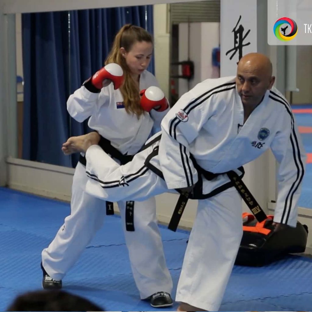 Master Daher demonstrating back kick as a counter-attacking.