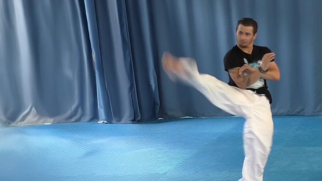 Mark Trotter demonstrates a twisting kick during Sam-Il pattern coaching