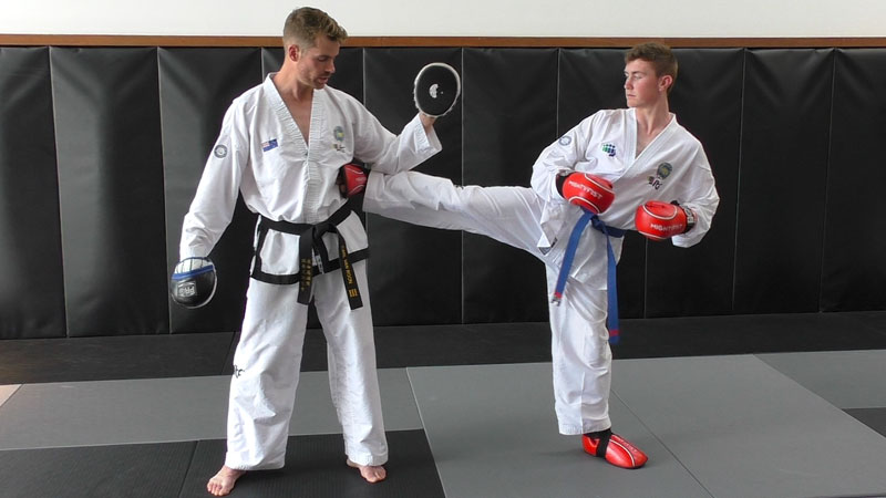 ITF Taekwon-Do student training mitt holding, with Carl van Roon.