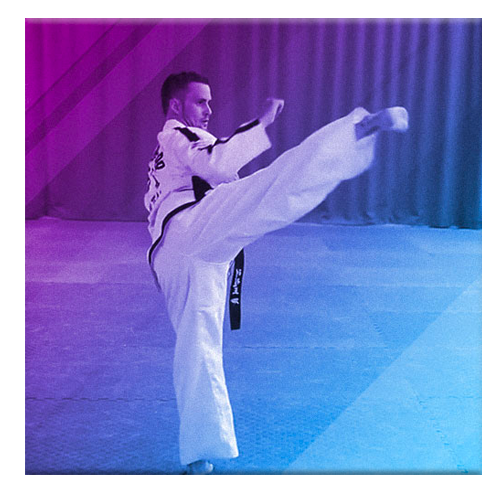 Master Mark Trotter performing slow motion kick in a TKD Pattern