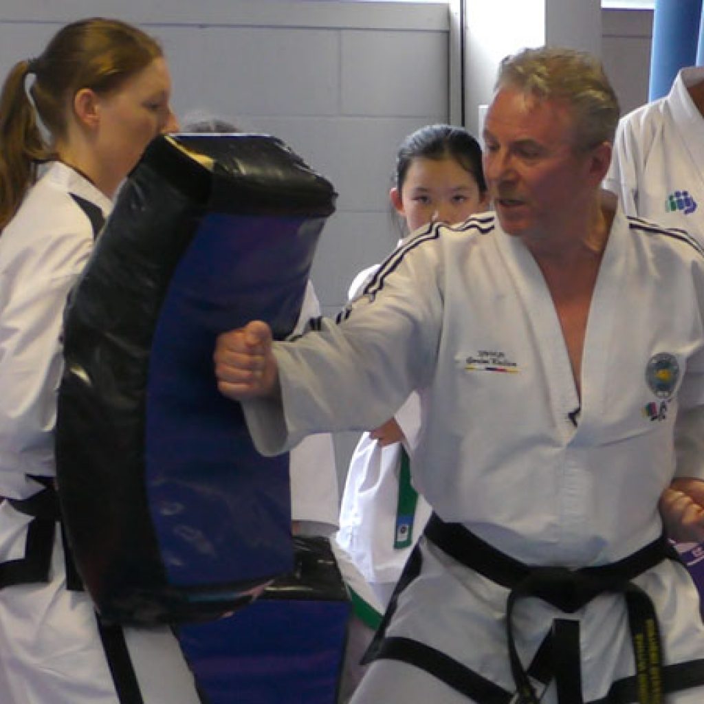 Master Gordon Wallace demonstrating power generation using hip rotation and relaxation during a Taekwon-Do training session