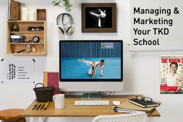 Managing and marketing a Taekwon-Do school course shown on a desk workspace setup