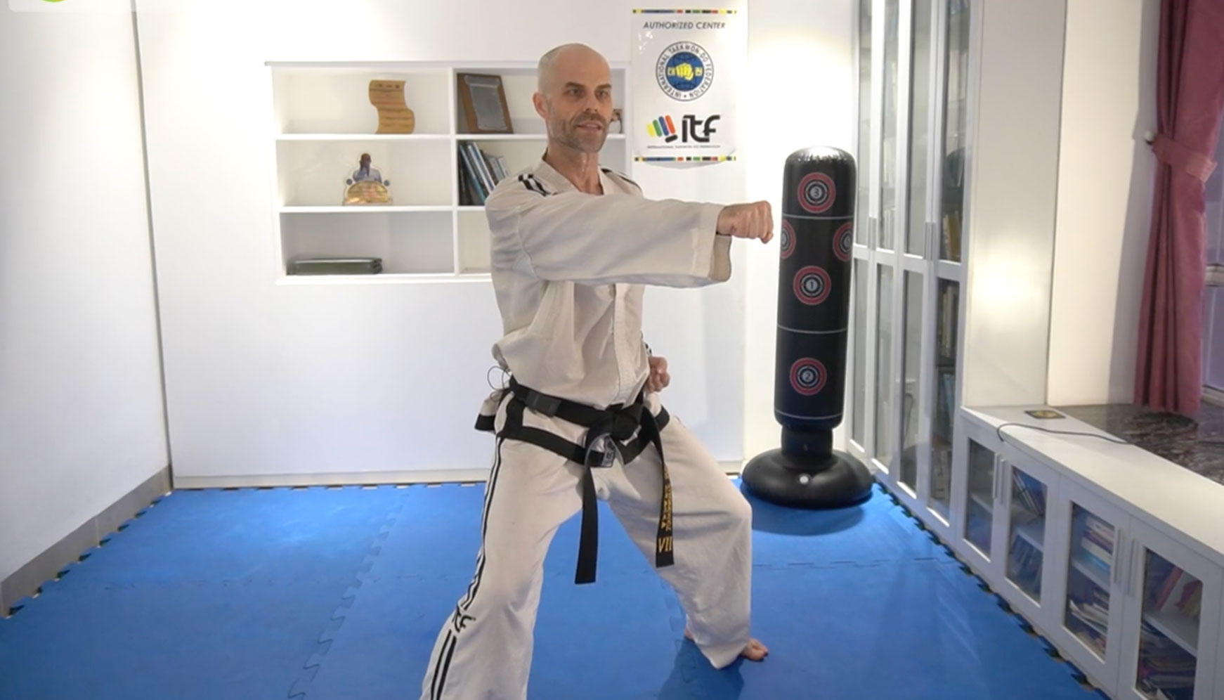 Master Mariusz demonstrating a sitting stance punch in ITF Taekwon-Do.