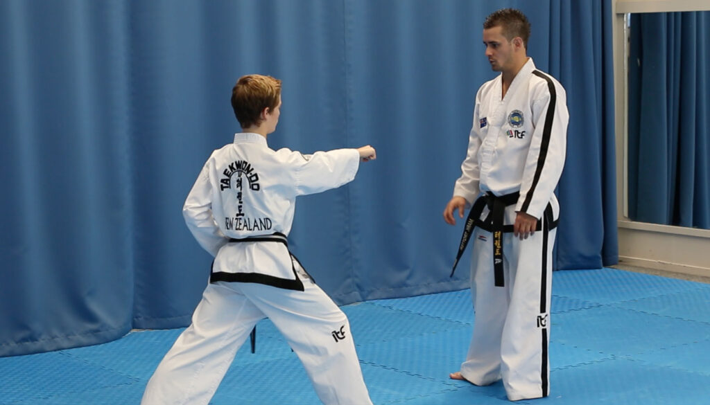 The opening stance of Chon-Ji pattern for the middle punch demonstrated in an ITF Taekwon-Do class.